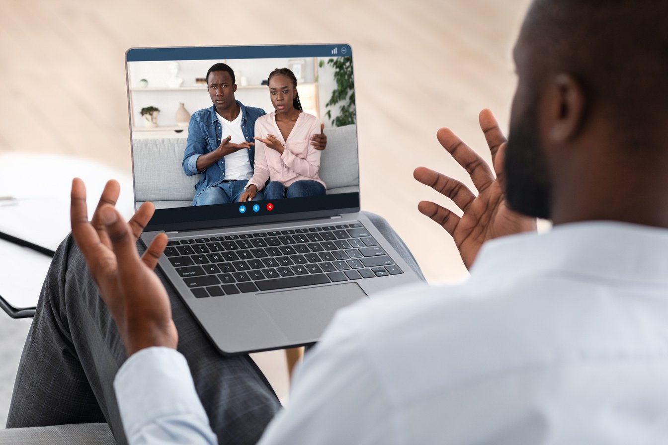 During Quarantine. Black Councelor Consulting Spouses Online On Laptop